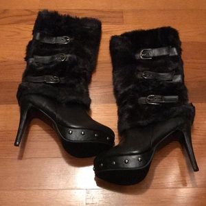 Black heeled knee high boots with faux fur detail